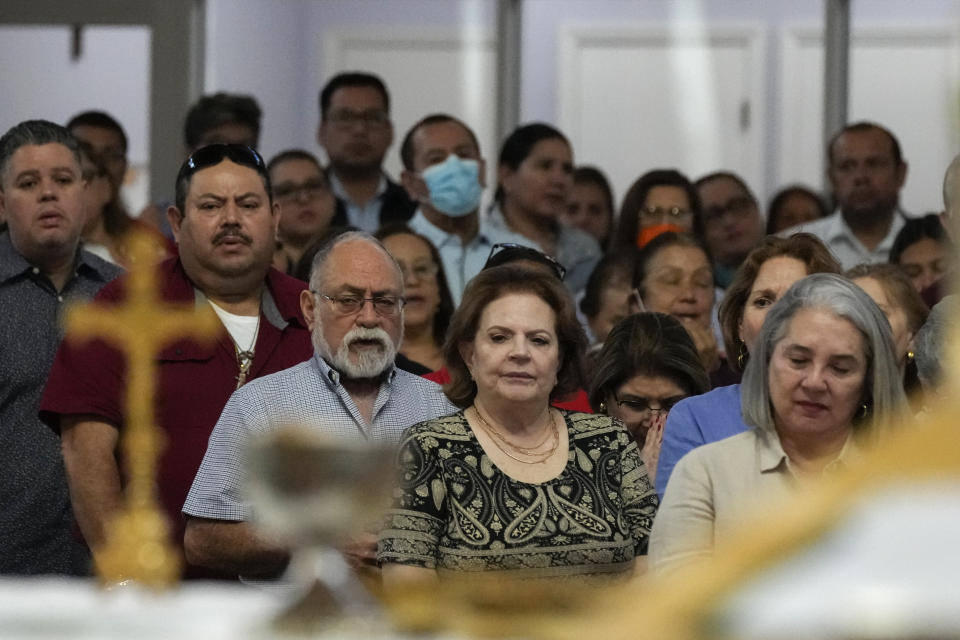 Parishioners attend Mass at St. Agatha catholic church, which has become the spiritual home of the growing Nicaraguan diaspora, Sunday, Nov. 5, 2023, in Miami. For the auxiliary bishop of Managua, one of his concelebrant priests and many in the pews who have had to flee or were exiled from Nicaragua recently, the Sunday afternoon Mass at the Miami parish is not only a way to find solace in community, but also to keep pushing back against the Ortega regime's violent suppression of all critics, including many Catholic leaders. (AP Photo/Rebecca Blackwell)