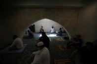 Muslims attend Friday prayers at al Husseini mosque in Amman