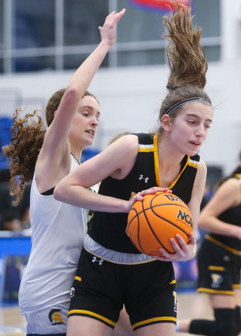 Saint Mark's Sophia Karch (left) can't get to a rebound before Padua's Abigail Grillo in the second half of Padua's 52-49 win in the SL24 Memorial Classic at the Chase Fieldhouse on Feb. 2.