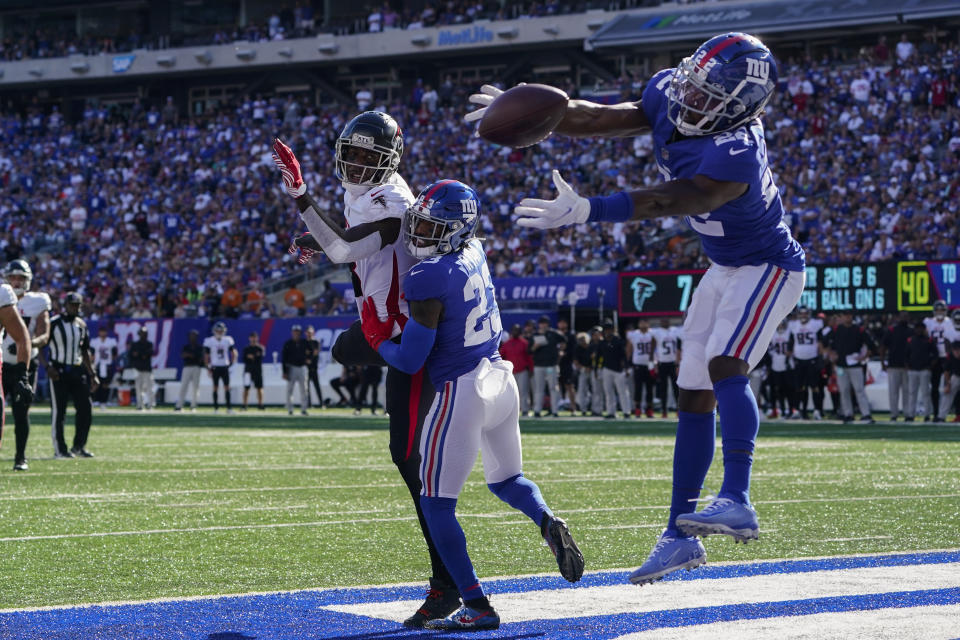 New York Giants cornerback James Bradberry (24) misses a potential intercept on a pass intended for Atlanta Falcons tight end Kyle Pitts, center left, in the end zone during the second half of an NFL football game, Sunday, Sept. 26, 2021, in East Rutherford, N.J. (AP Photo/Seth Wenig)