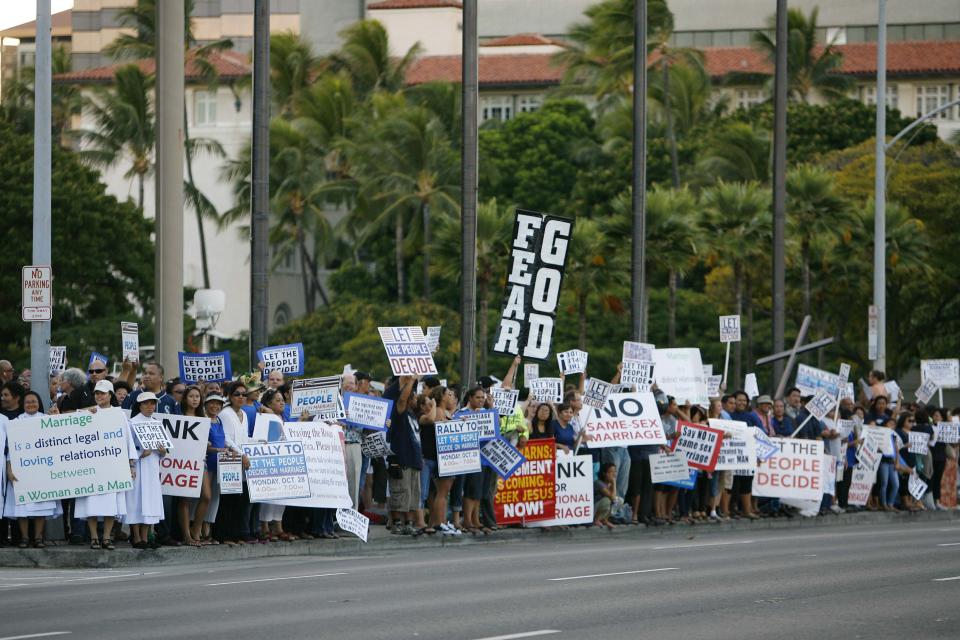 People gather at a rally against same sex marriage at the Hawaii State Capital in Honolulu