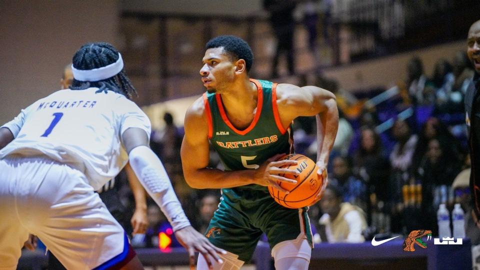 Florida A&M University men's basketball forward Jaylen Bates (5) looks to pass with Alcorn State forward Dontrell McQuarter defending at Davey L Whitney Complex, Lorman, Mississippi, Saturday, Jan. 21, 2023