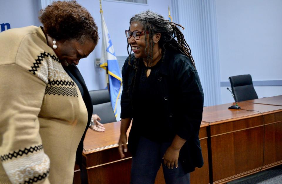 Jessica Scott and Tekesha Martinez laugh together after Martinez was named Hagerstown's first Black mayor during a city council meeting Tuesday. Scott and Martinez are longtime friends who have worked together to help the Jonathan Street community.