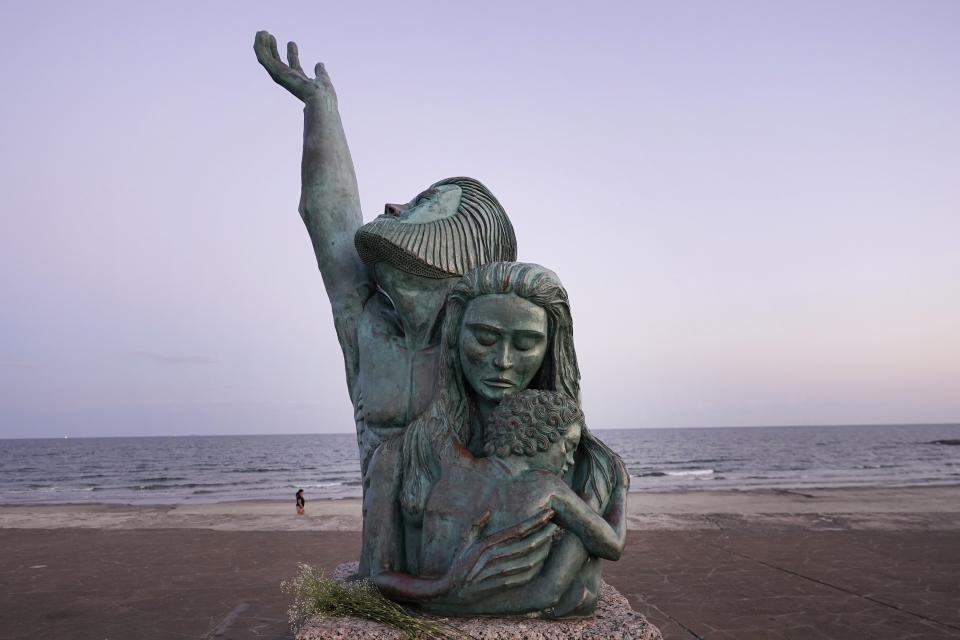 The 1900 Great Storm Statue sits on the sea wall in Galveston, Texas, Monday, Sept. 18, 2023. (AP Photo/LM Otero)