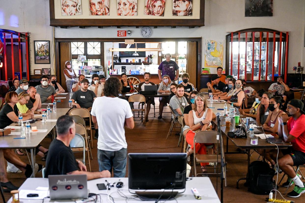 Jerry Norris, center, speaks during the People's Council meeting on Wednesday, July 20, 2022, at The Fledge in Lansing.