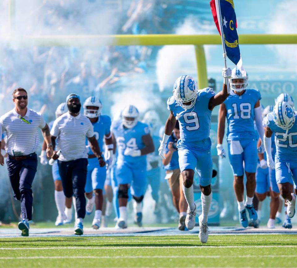 North Carolina wide receiver Devontez Walker (9) leads the team into Kenan Stadium for their game against Syracuse on Saturday, October 7, 2023 at Kenan Stadium in Chapel Hill, N.C. Walker was granted eligibility this week by the NCAA to play in his first game of the 2023 season for the Tar Heels.