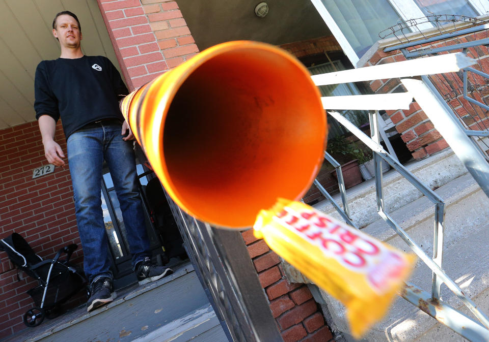 Geoff Burke is behind an initiative with the Daily Bread Food Bank to install candy chutes in front of people's porches so kids can trick-or-treat without so much as jeopardizing their health and safety during COVID-19 in Toronto on October 16, 2020. (Steve Russell/Toronto Star via Getty Images)