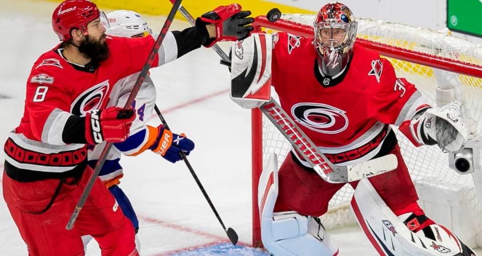 The Carolina Hurricanes Brent Burns (8) reaches for the puck in front of goalie Antii Raanta (32) in the third period during Game 5 of their Stanley Cup series on Tuesday, April 25, 2023 at PNC Arena in Raleigh, N.C.