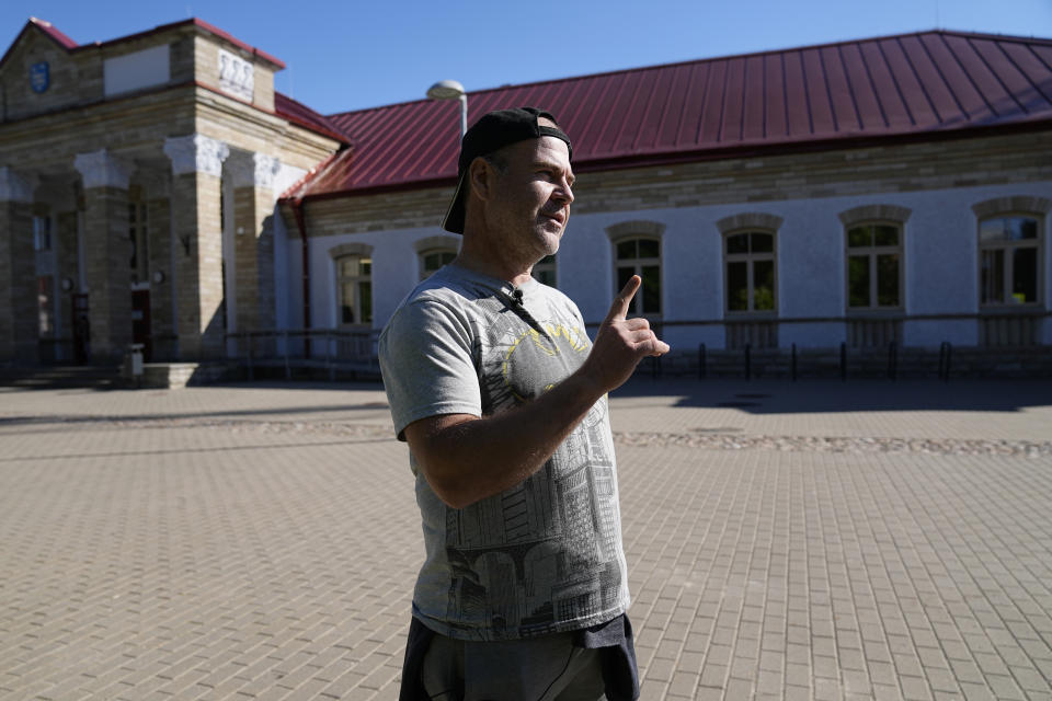 Oleksandr Fedorov speaks in Narva, Estonia, Thursday, June 16, 2022. Fedorov is a Mariupol resident who was outside Ukraine when the war started. He's now part of the chain of volunteers helping people to reach Europe through Russia. His wife and one child are still in the city. (AP Photo)