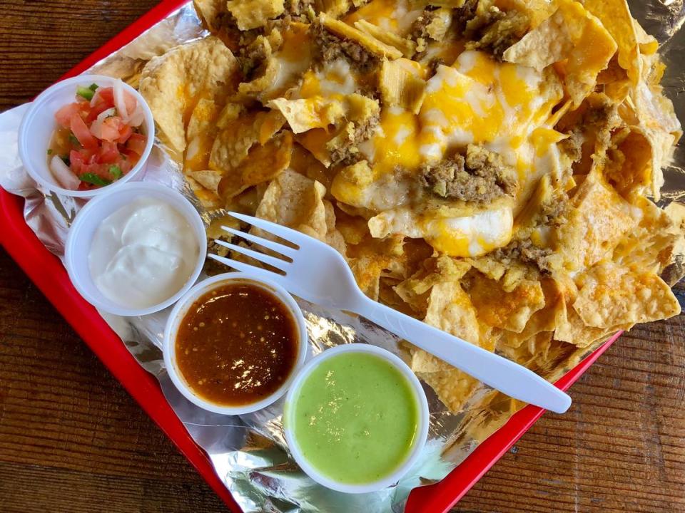 “Tamale nachos” at Tommy Tamale feature — well, tamale bites on chips with cheese and salsa