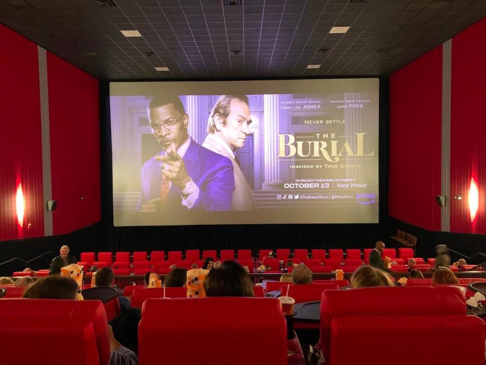 With popcorn and beverages at the ready, people settled into their seats at Premiere Lux cinema in Biloxi Tuesday at a special premiere showing of “The Burial.” The movie is based on a lawsuit brought by the late Jeremiah O’Keefe, a Coast funeral director.