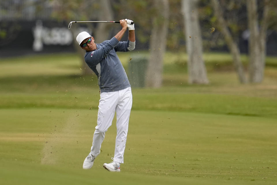 Rickie Fowler hits from the fairway on the second hole during the first round of the U.S. Open golf tournament at Los Angeles Country Club on Thursday, June 15, 2023, in Los Angeles. (AP Photo/George Walker IV)