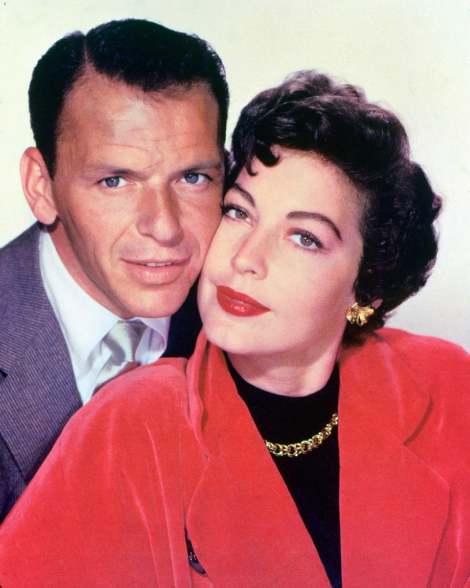 Frank Sinatra (1915-1998), US singer and actor, and his wife, US actress Ava Gardner (1922-1990), posing cheek-to-cheek in a studio portrait, against a white background, circa 1953. The couple were married in 1951 and divoced in 1957. (Photo by Silver Screen Collection/Getty Images)