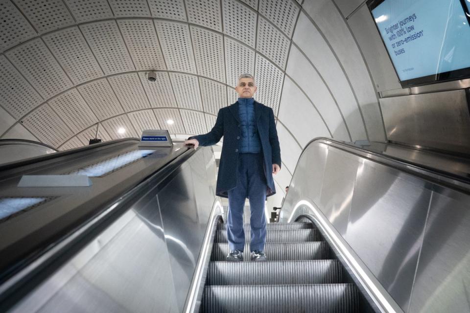 Sadiq Khan rides an escalator at Bond Street (Stefan Rousseau / PA)