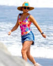 <p>Kate Hudson serves up some serious summer vibes at the beach in a tie-dye swimsuit on Tuesday in Malibu. </p>