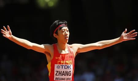 Zhang Guowei of China gestures as he competes in the men's high jump qualifying round during the 15th IAAF World Championships at the National Stadium in Beijing, China, August 28, 2015. REUTERS/Kai Pfaffenbach