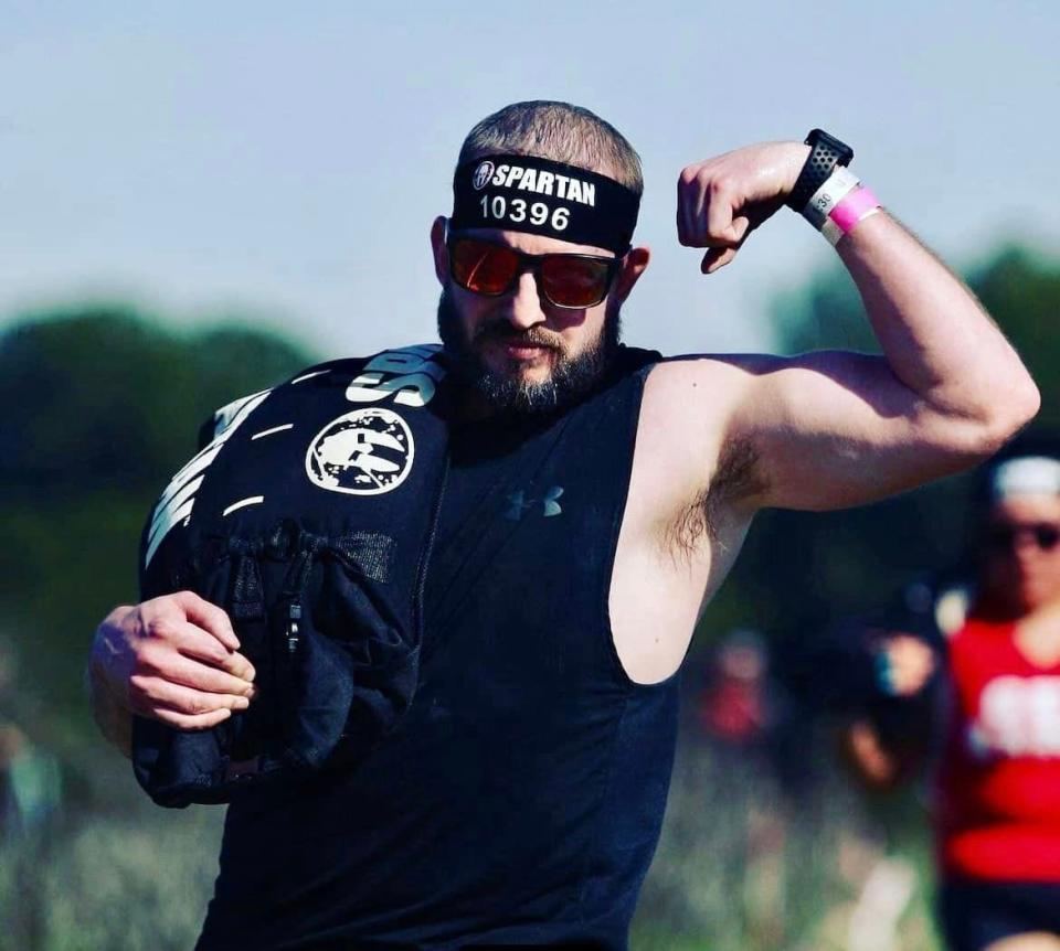 The late Erinn McGee is shown participating in a Spartan Race.