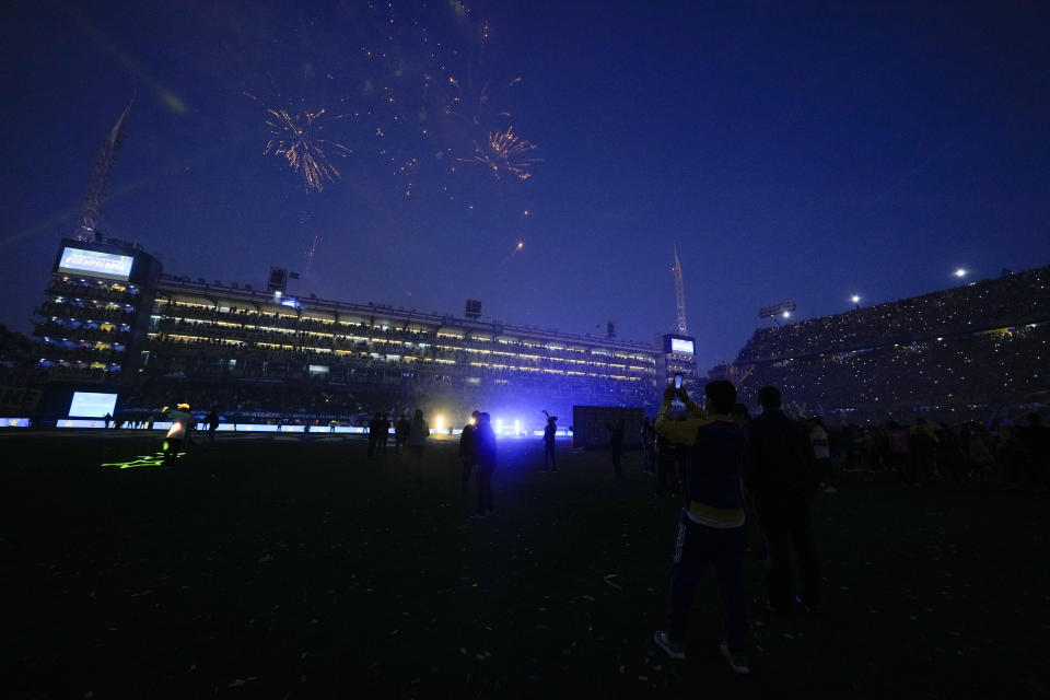 Fireworks fly overhead as Boca Juniors celebrates becoming the local soccer tournament champions after a match against Independiente in Buenos Aires, Argentina, Sunday, Oct. 23, 2022. (AP (AP Photo/Natacha Pisarenko)