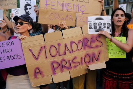 Protesters chant slogans during a demonstration against the release on bail of five men known as the "Wolf Pack" cleared of gang rape of a teenager and convicted of a lesser crime of sexual abuse in Seville, Spain, June 22, 2018. REUTERS/Marcelo del Pozo