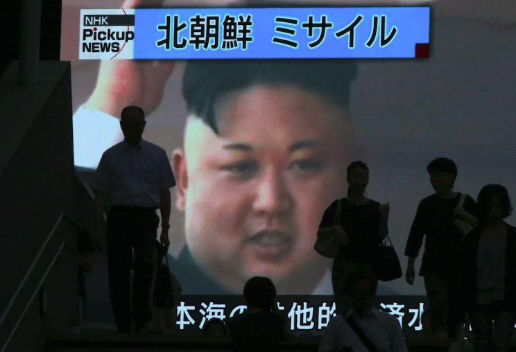Kim Jong-un's images beams out of a TV screen in Toyko, Japan (Picture: Rex)