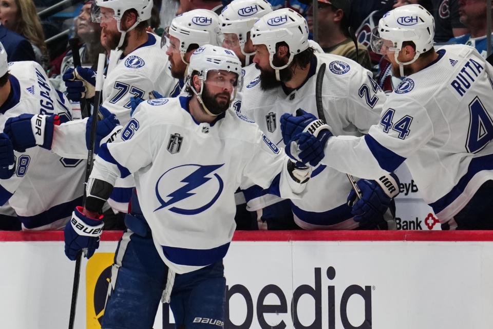 Tampa Bay Lightning right wing Nikita Kucherov (86) is congratulated for his goal against the Colorado Avalanche during the second period in Game 5 of the NHL hockey Stanley Cup Final, Friday, June 24, 2022, in Denver. (AP Photo/Jack Dempsey)