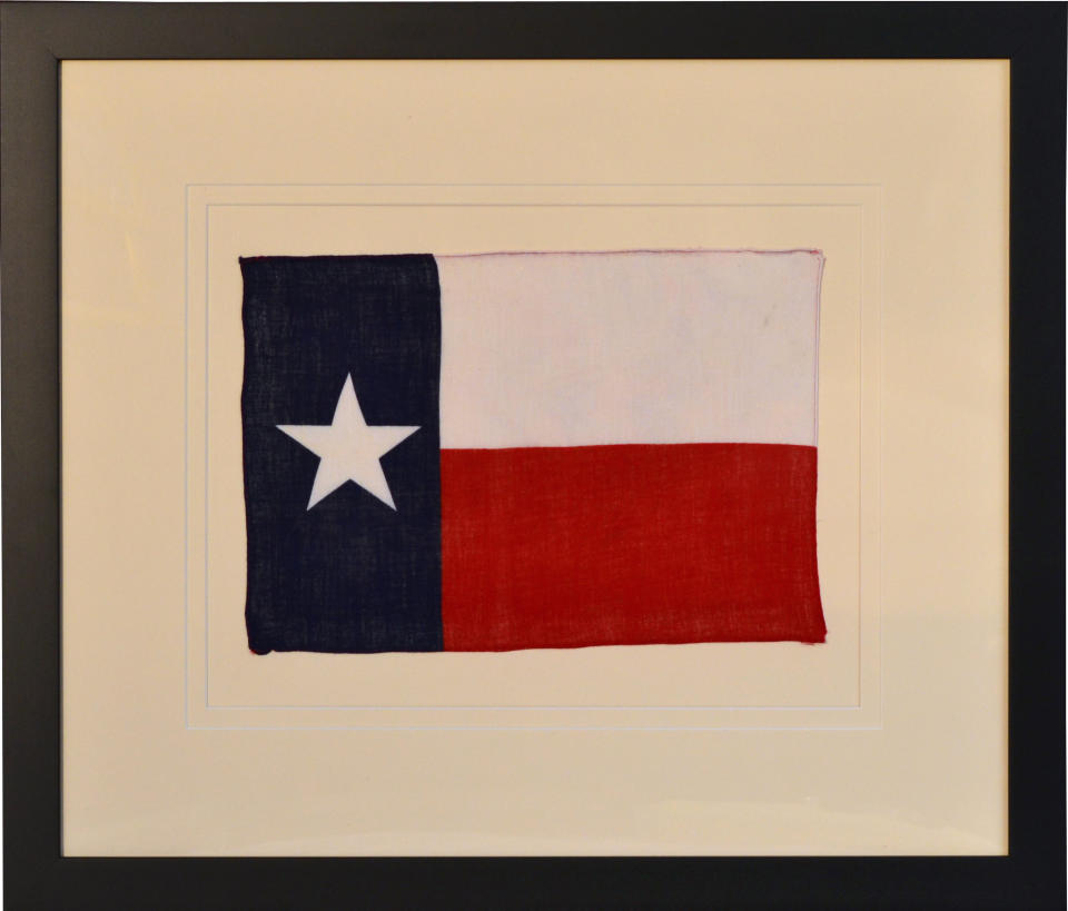 Vintage Texas flag with sewn edges from the 1936 Centennial in Dallas that celebrated the 100th anniversary of the battle with Mexico that resulted in the Republic of Texas. Archivally framed. Flag, 8"W x 11"L.  <strong>From</strong>: <a href="https://www.onekingslane.com/sales/20059?utm_source=HuffPo&utm_medium=display&utm_content=HuffPO&utm_campaign=flags" target="_blank">One Kings Lane</a>