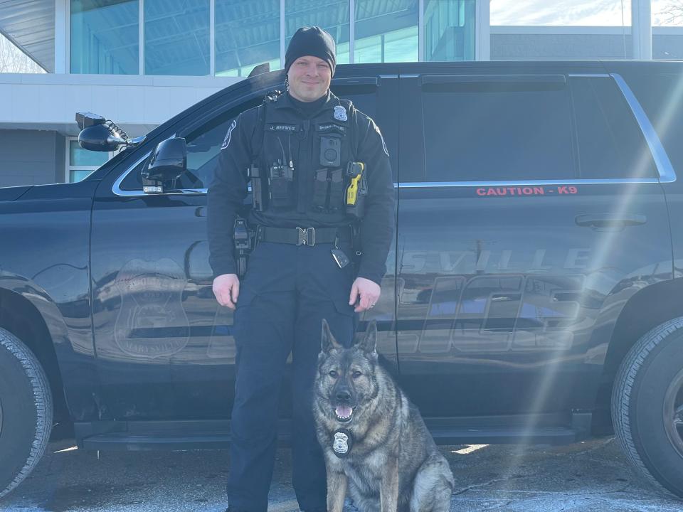 Officer Justin Reeves and Heiko in front of their squad car on Jan. 31, 2023. Reeves and Heiko were partners for the last seven years.