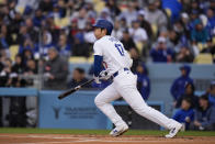 Los Angeles Dodgers' Shohei Ohtani watches after hitting a single against the St. Louis Cardinals during the first inning of a baseball game Saturday, March 30, 2024, in Los Angeles. (AP Photo/Jae C. Hong)