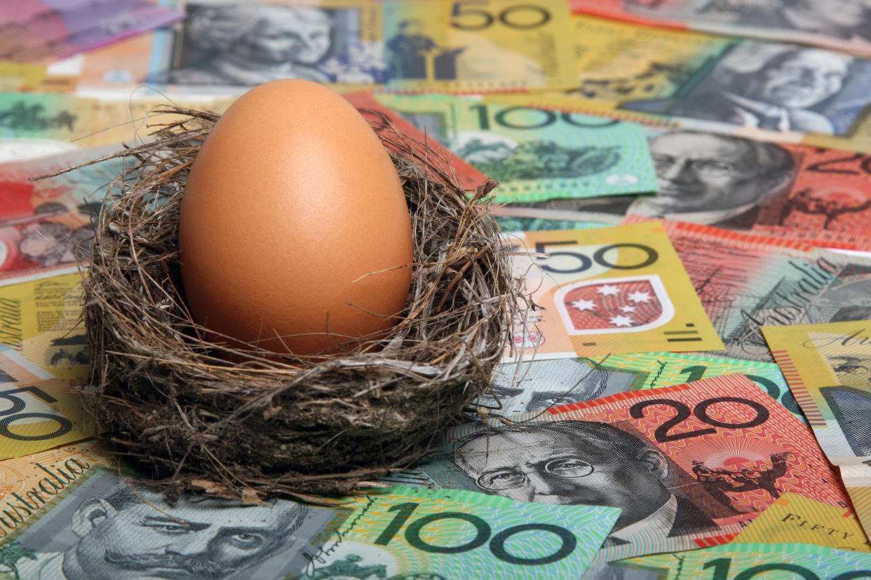 Savings nest egg with Australian dollar notes aa focus on egg. Click to see more...