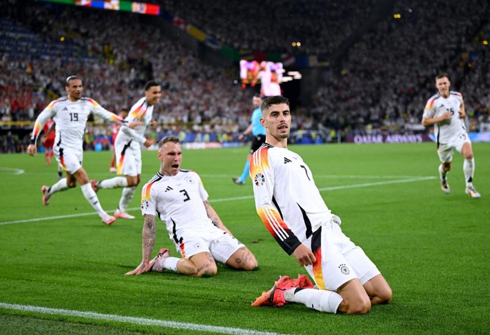 Kai Havertz slides in celebration after Germany take the lead (Getty Images)