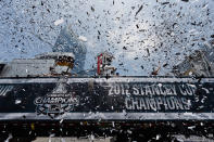 LOS ANGELES, CA - JUNE 14: The Stanley Cup is hoisted by Los Angeles Kings team members in the middle of confetti during the Stanley Cup victory parade on June 14, 2012 in Los Angeles, California. The Kings are celebrating their first NHL Championship in the team's 45-year-old franchise history. (Photo by Kevork Djansezian/Getty Images)