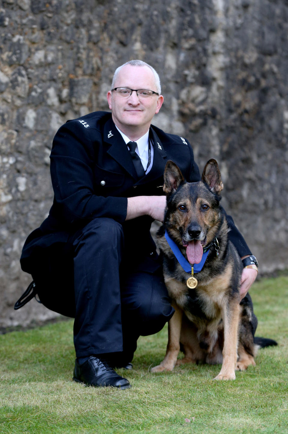 Police dog Finn with his handler. Police dogs and horses will have more protection from attacks when a new law named after the hero police dog came into force in early June