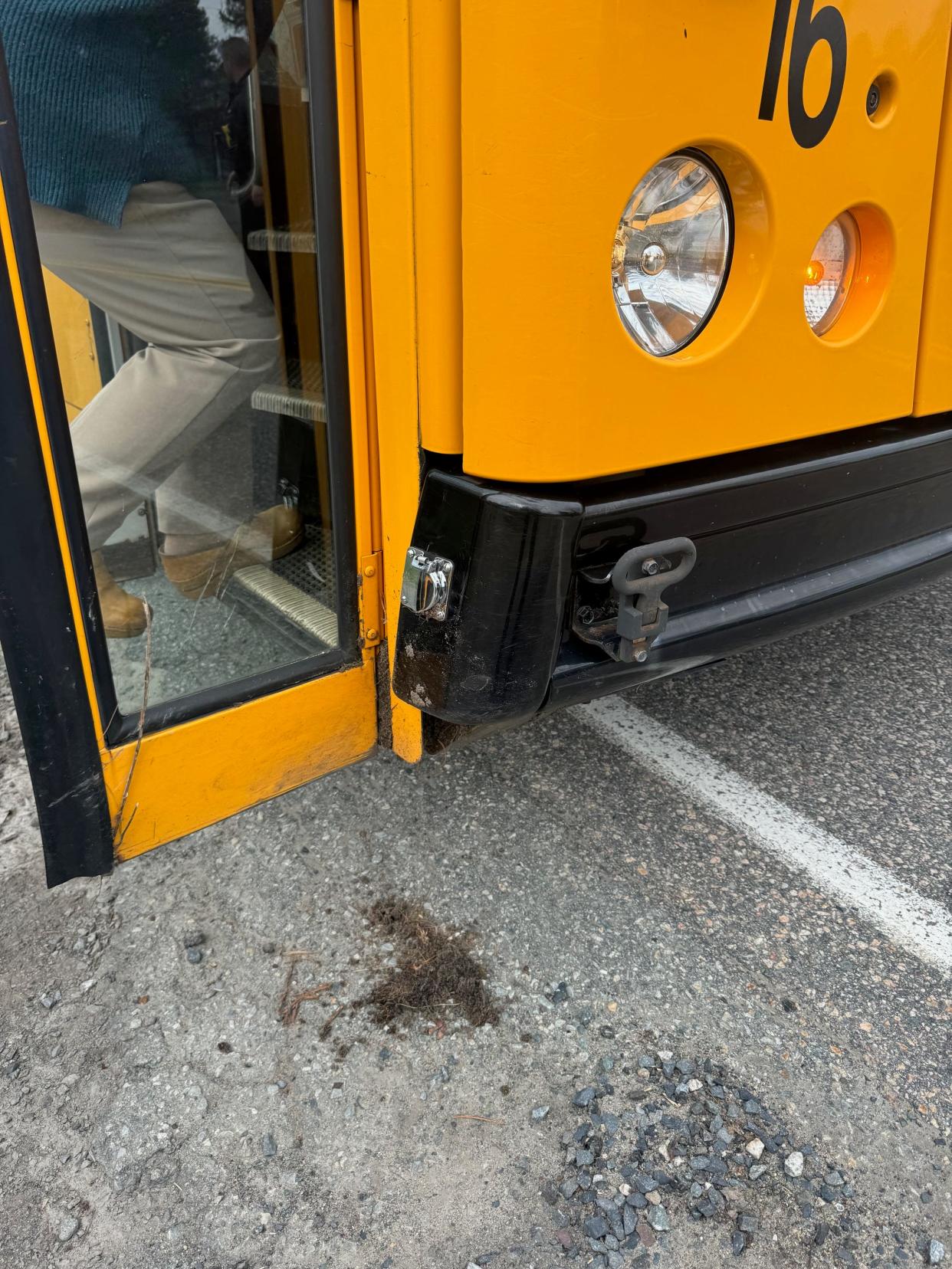 Millis police are accusing a bus driver of assaulting a woman who confronted him on Wednesday after he allegedly struck some trash barrels and bushes while attempting to make a three-point turn.