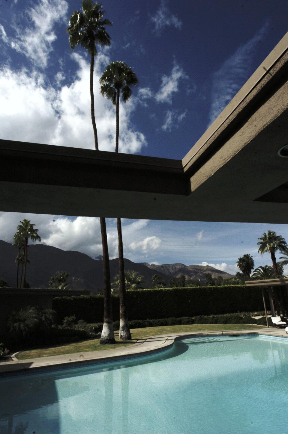 The home of Frank Sinatra with the original two Palms that gave the house its name of Twin Palms.