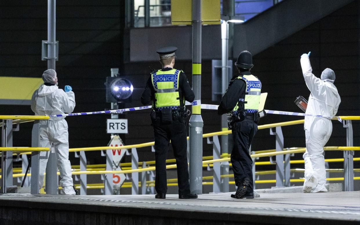 Investigators work at the scene on Metrolink Platform B at Victoria Station - London News Pictures Ltd