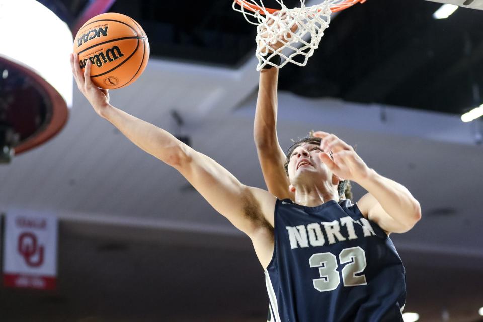 Edmond North's Bryce Potts (32) goes for a layup in last year's Class 6A championship game against Broken Arrow at Lloyd Noble Center in Norman.