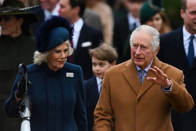 charles waving next to wife camilla