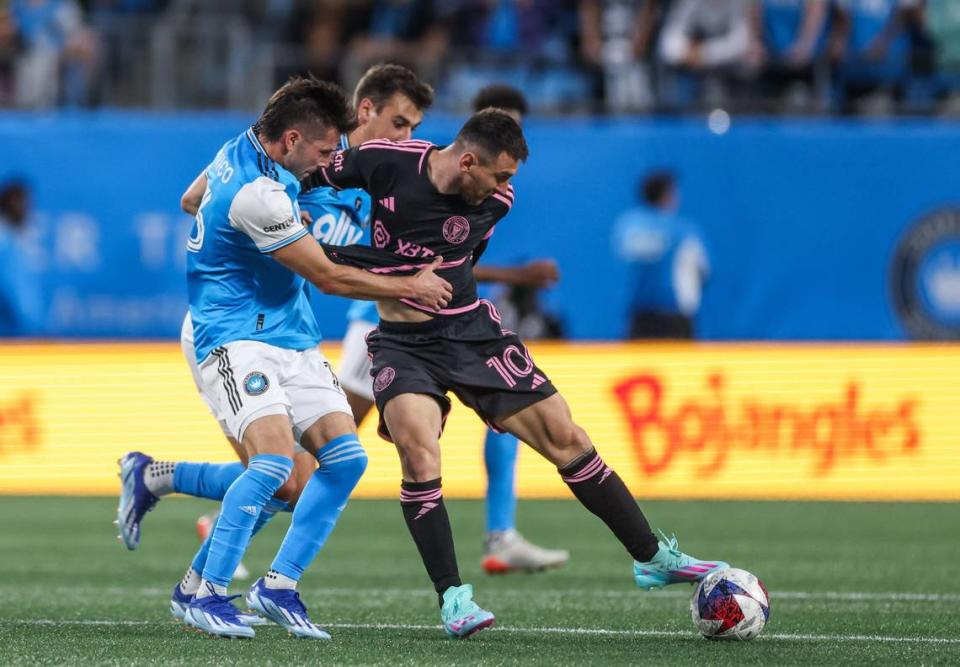 Inter Miami forward Lionel Messi, right, controls the ball in front of Charlotte FC midfielder Brandt Bronico at the Bank of America Stadium in Charlotte, N.C., on Saturday, October 21, 2023.