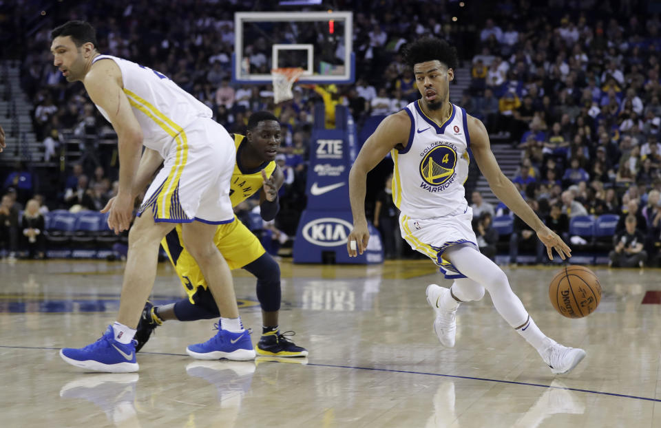 Golden State Warriors’ Quinn Cook (4) drives around Indiana Pacers’ Darren Collison, center, on a screen from Zaza Pachulia, left, during the second half of an NBA basketball game Tuesday, March 27, 2018, in Oakland, Calif. (AP Photo/Marcio Jose Sanchez)