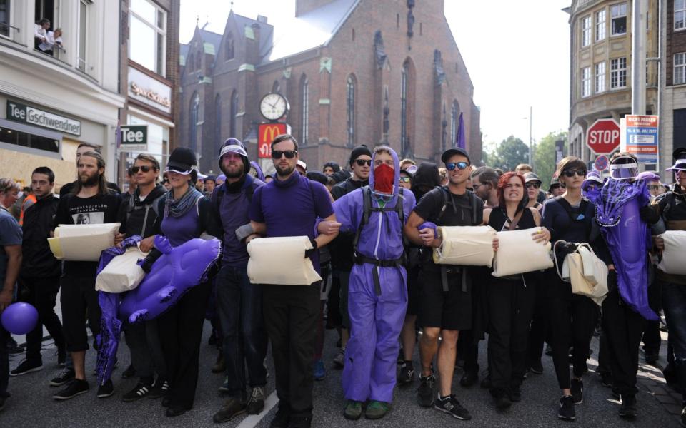 Demonstrators on Friday in Hamburg - Credit: STEFFI LOOS/AFP/Getty Images