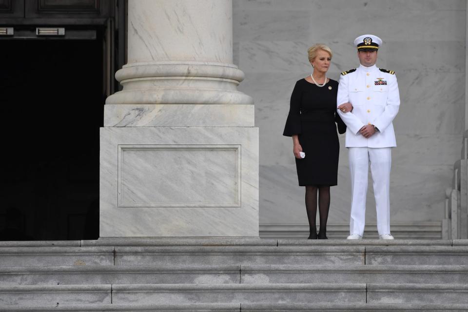 21) John McCain's wife Cindy and her son John Sidney McCain await the late Senator's casket on August 31/