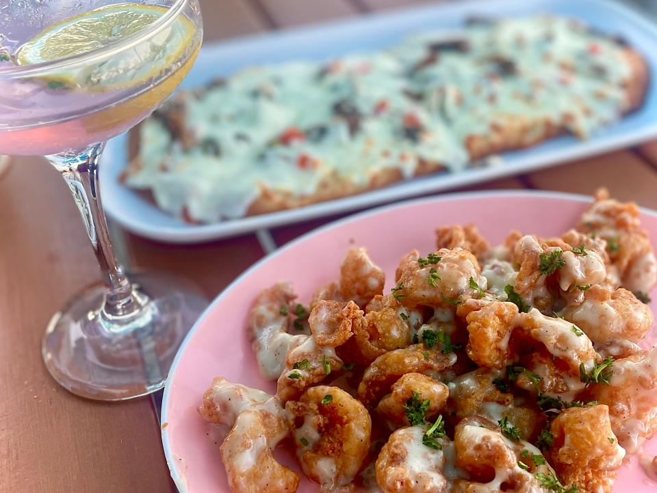 Twisted shrimp, Philly flatbread and Island Thyme cocktail from the Funky Pelican in Flagler Beach.