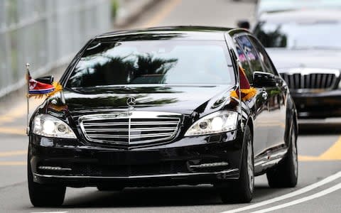 The motorcade of North Korea leader Kim Jong Un leaves the St. Regis Hotel on the way to the Capella Hotel - Credit: AP