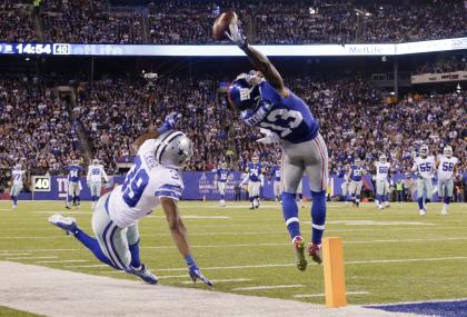 Odell Beckham Jr. makes a one-handed catch for a TD against the Cowboys. (AP)