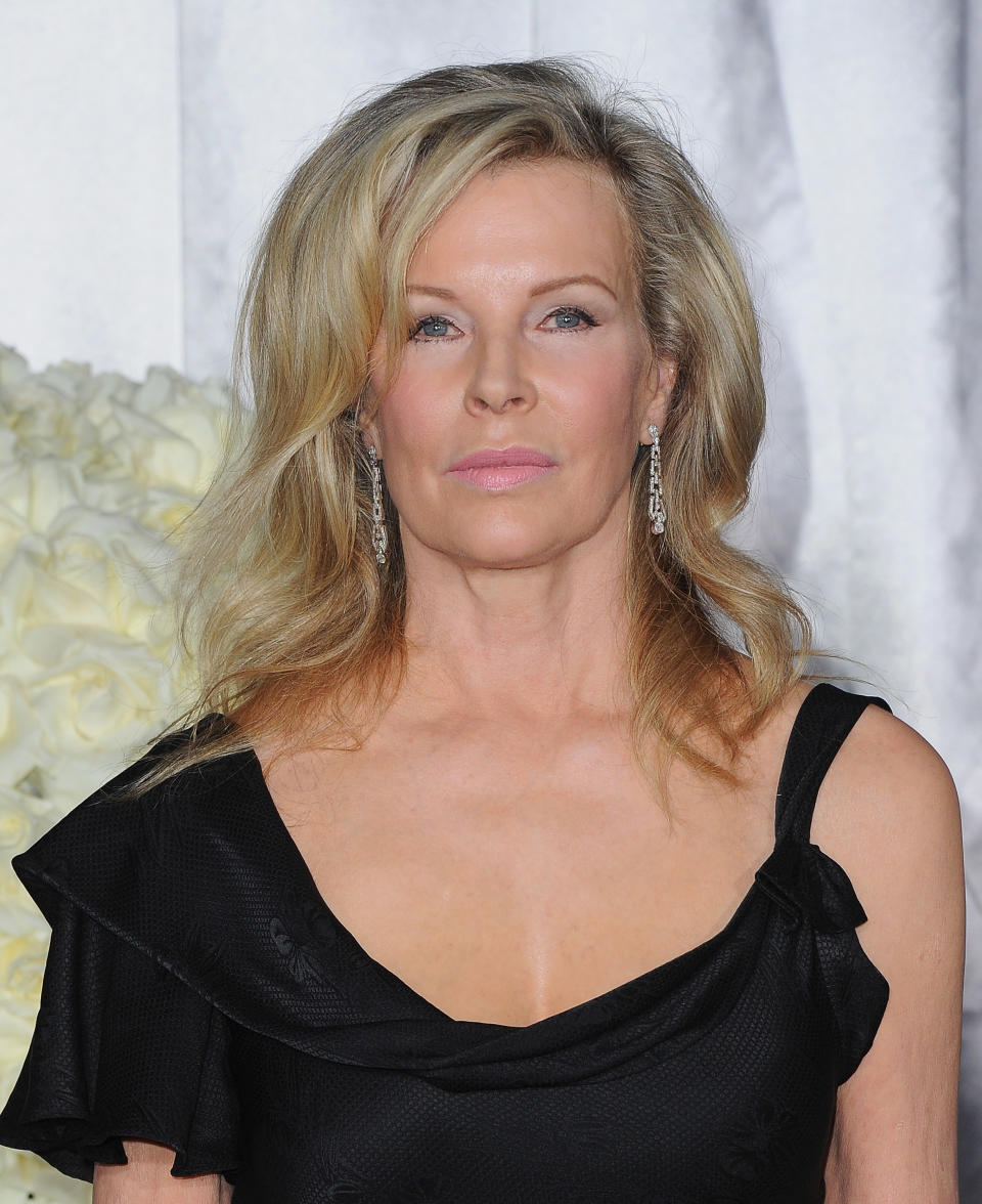 Kim Basinger posing at a film premiere