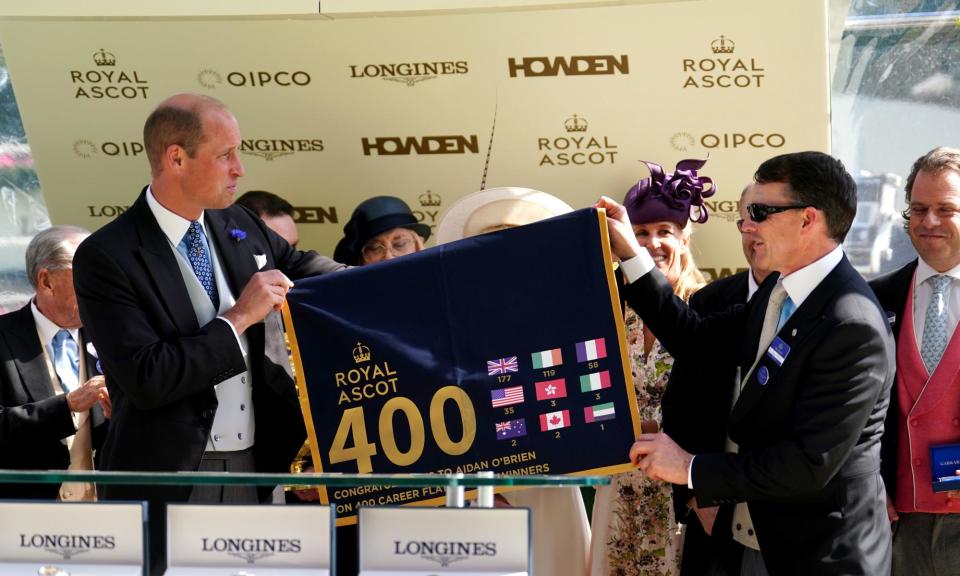 <span>Aidan O'Brien with the Prince of Wales after being presented with a saddle cloth representing his 400th Group One winner.</span><span>Photograph: David Davies/PA</span>