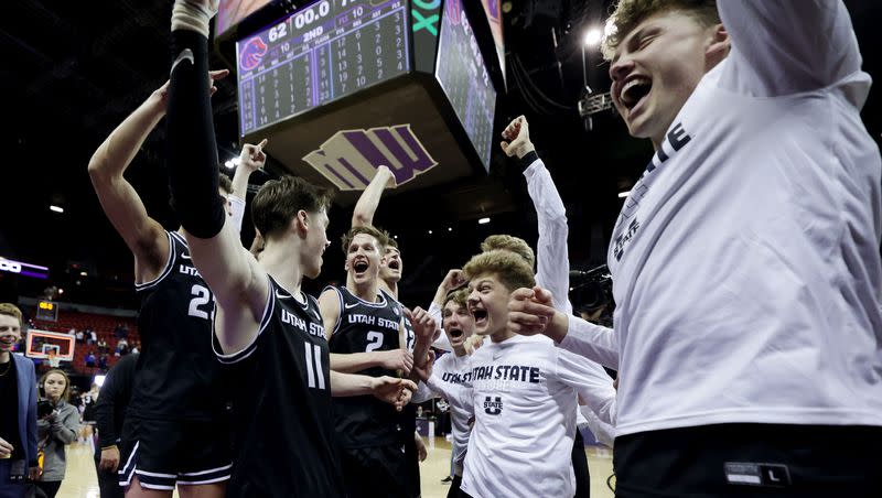 Utah State Aggies players celebrate after defeating Boise State in the semifinals of the Mountain West Conference Basketball Tournament at UNLV’s Thomas and Mack Center in Las Vegas on Saturday, March 11, 2023. Utah Sate won 72-62,