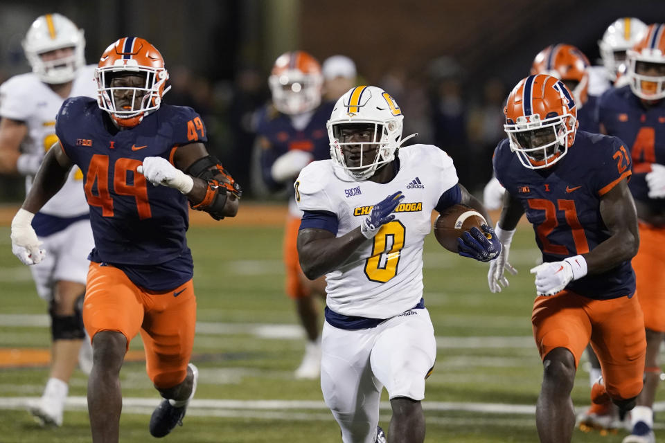 Chattanooga running back Ailym Ford breaks into the open during the first half of the team's NCAA college football game against Illinois on Thursday, Sept. 22, 2022, in Champaign, Ill. (AP Photo/Charles Rex Arbogast)