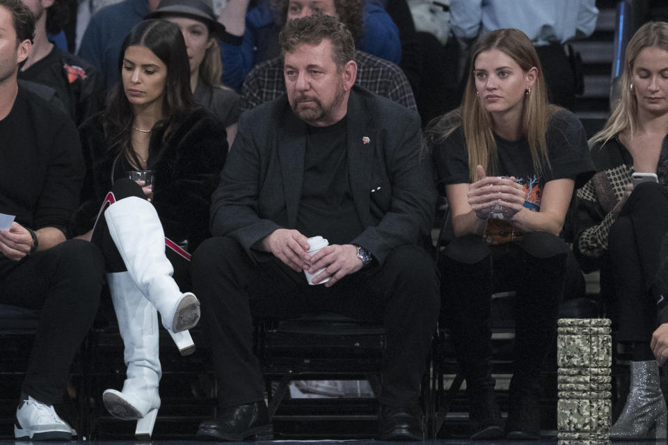 Madison Square Garden chairman James Dolan, center, watches the game action during the first half of an NBA basketball game between the New York Knicks and the Boston Celtics, Saturday, Oct. 20, 2018, at Madison Square Garden in New York. (AP Photo/Mary Altaffer)