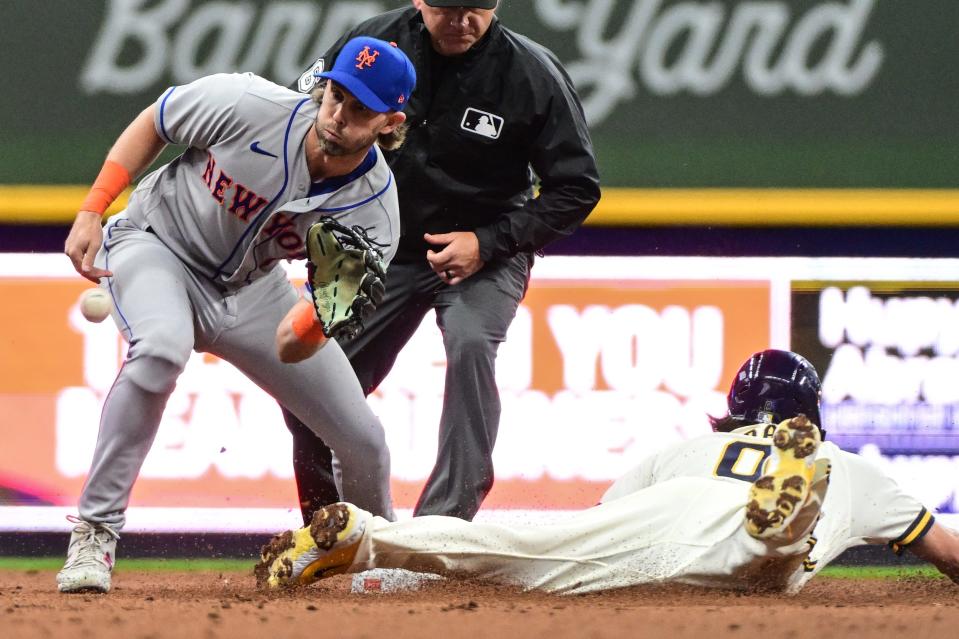 New York Mets left fielder Jeff McNeil takes a late throw as Milwaukee Brewers second baseman Bruce Turang steals second base in the third inning Monday at American Family Field.